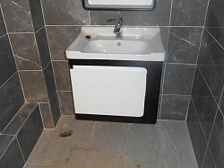 Modern wash hand basin installed which comes with a cabinet